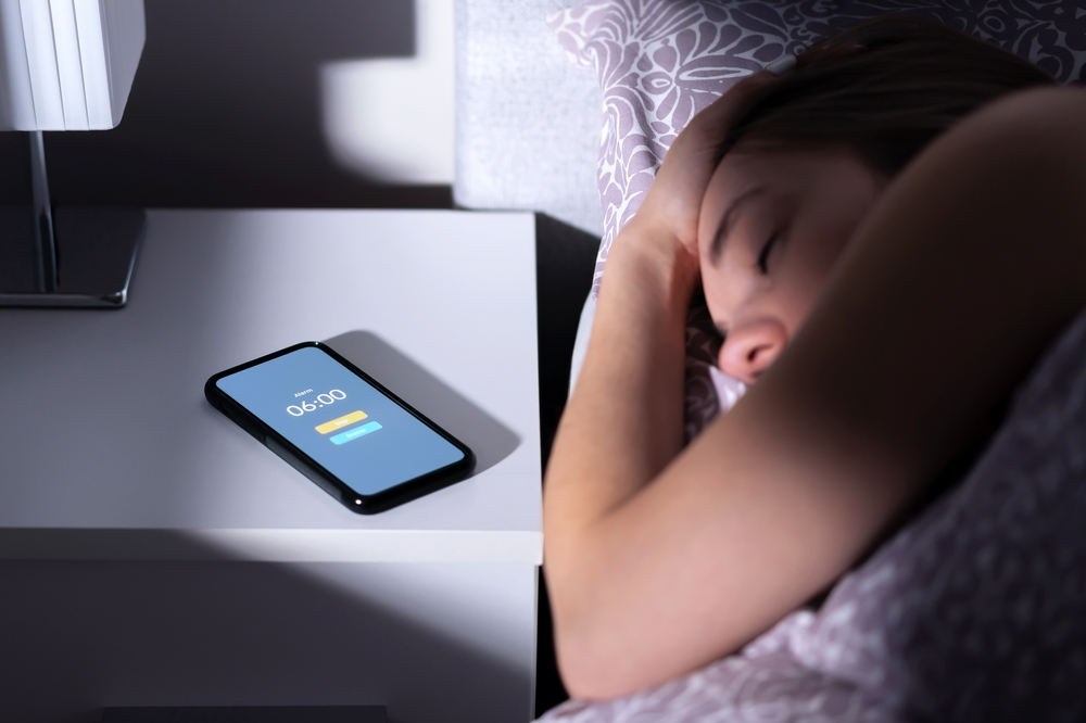 Phone,Alarm,Waking,Up,Tired,Sleeping,Woman,In,Bed,At - welltica.dk - Vejen til et bedre liv