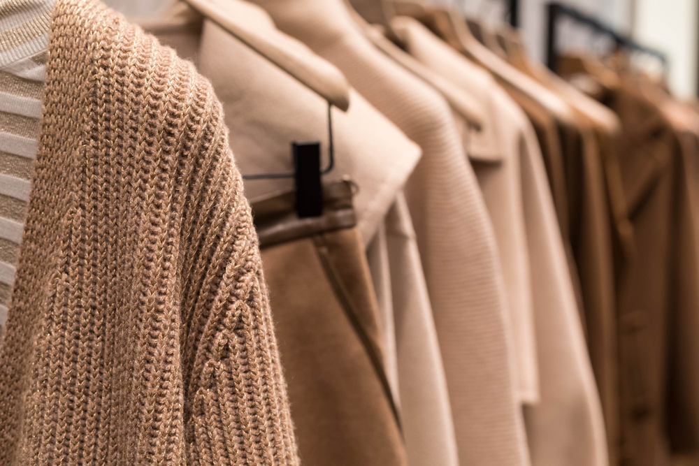 CoatAndSweaterLightBrownOnTheHangerInThe - welltica.dk - Vejen til et bedre liv
