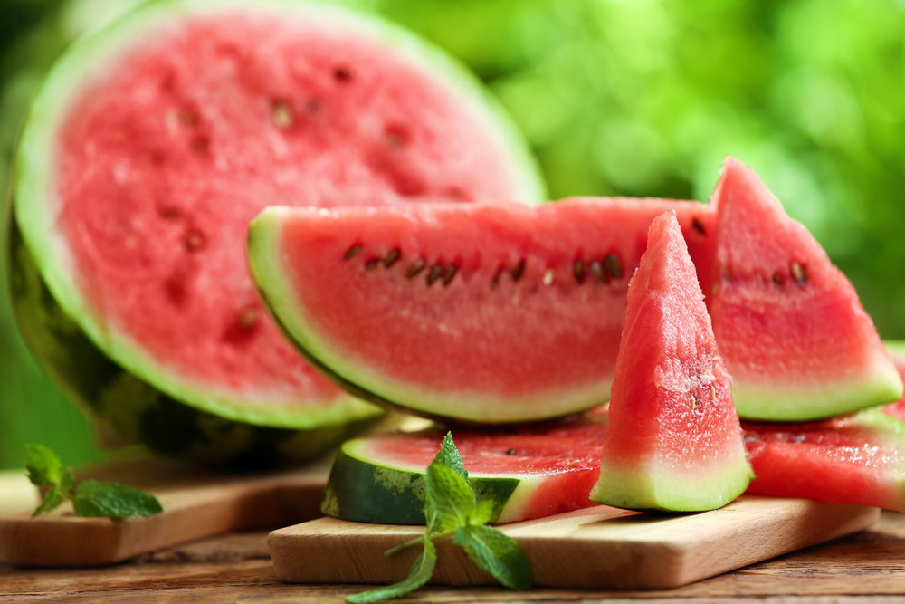 TastySlicedWatermelonOnTableOutdoors - welltica.dk - Vejen til et bedre liv